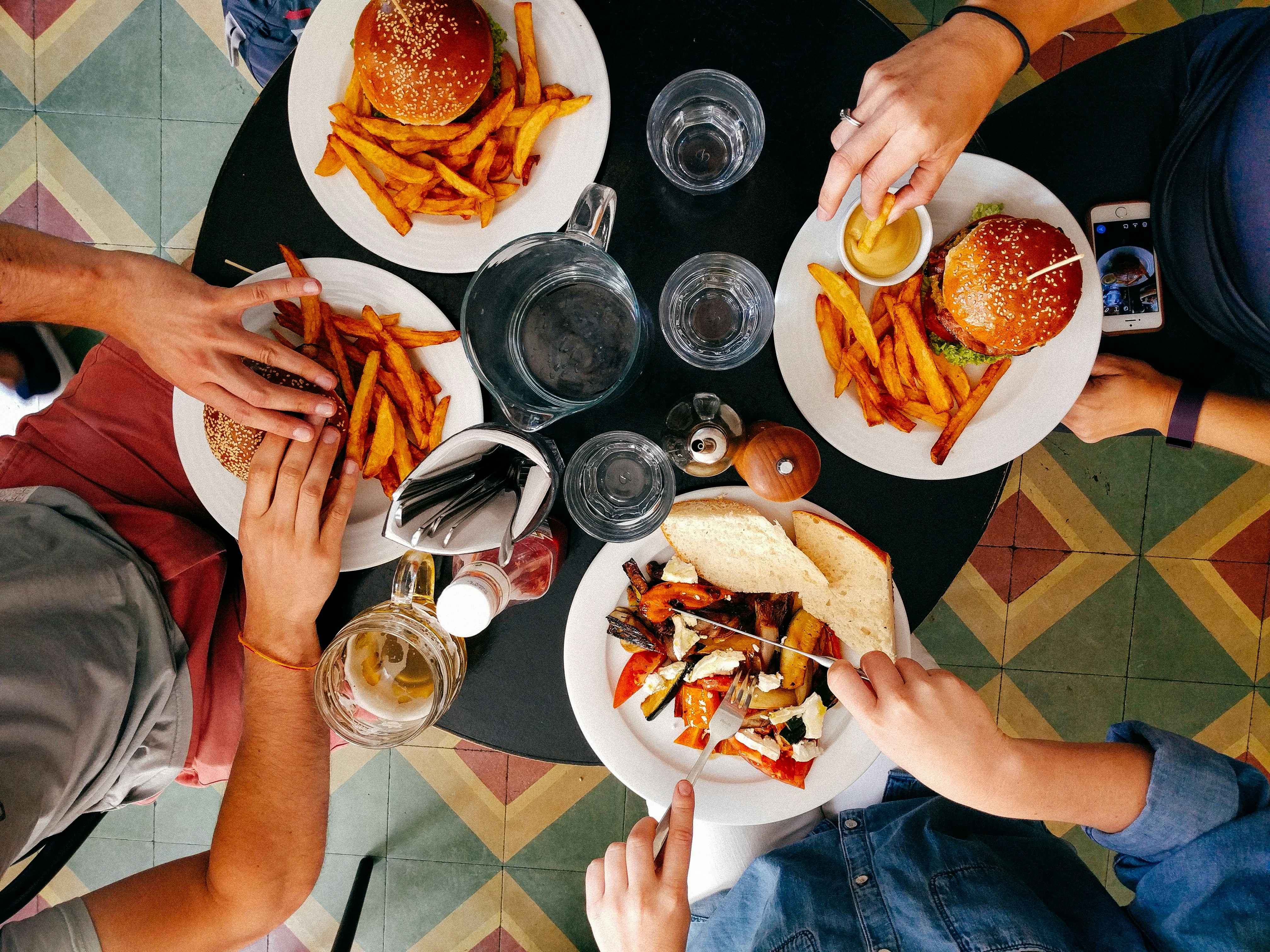 Group of people in restaurant paying bill